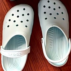 Light blue rubber crocs. Brand new condition only worn twice